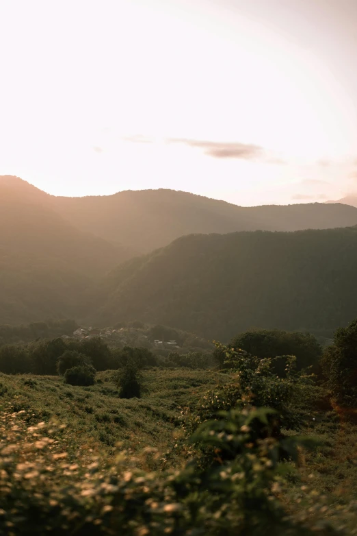 mountains are in the distance with buildings in the foreground