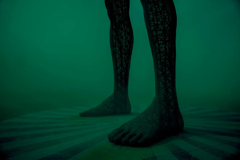 legs and feet in a ghostly dark room