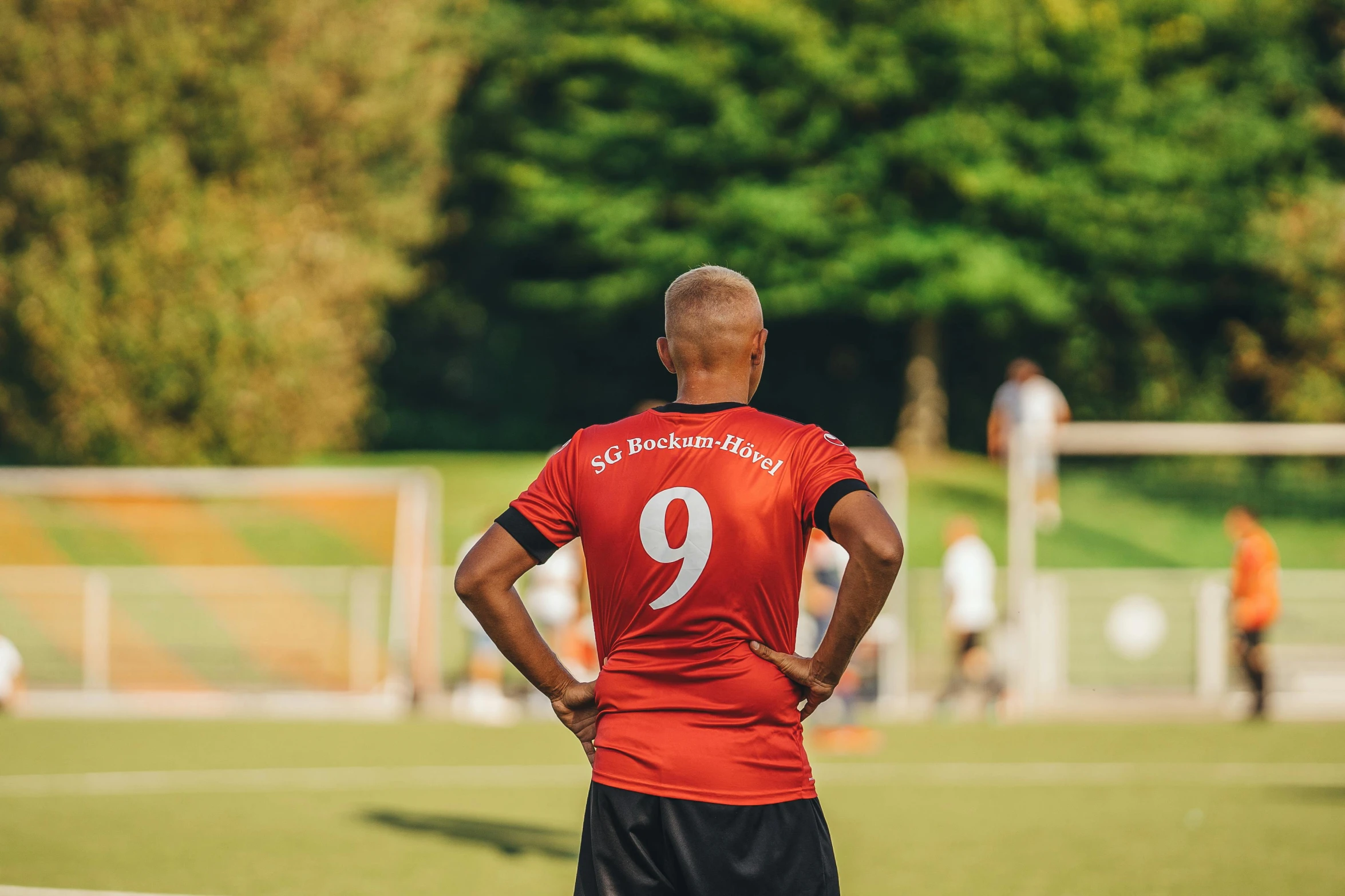 a man standing on top of a soccer field