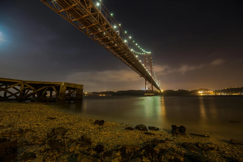 a bridge that has some lights on above it