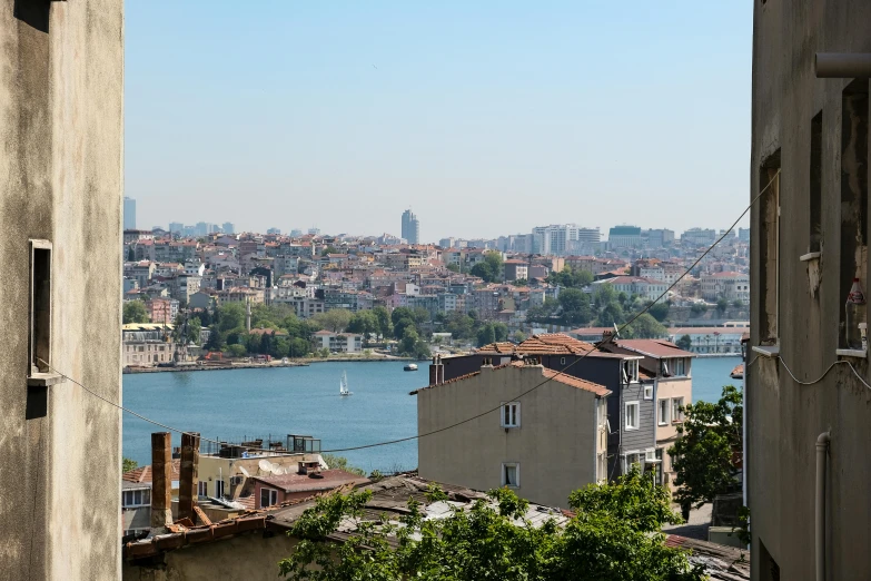 an urban scene from outside a window overlooking a river