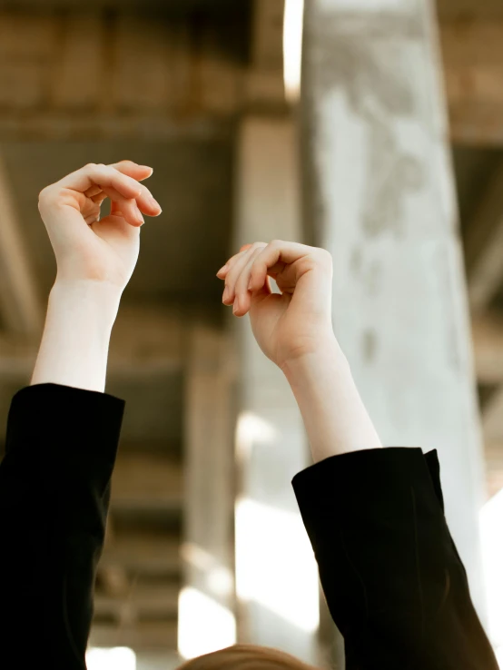 a hand holds a phone out with it