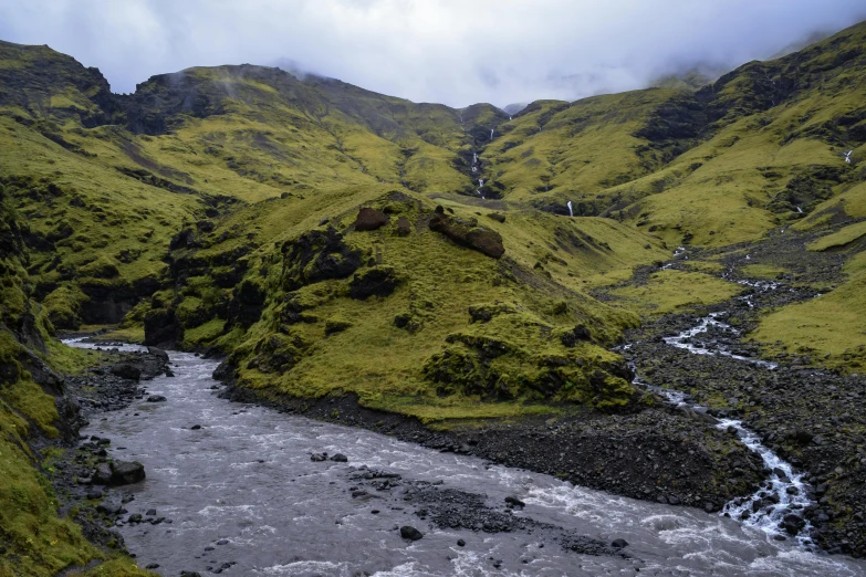 the creek flows into a mountain side