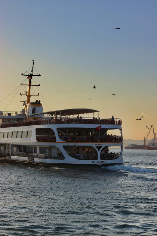 a cruise boat is carrying lots of people