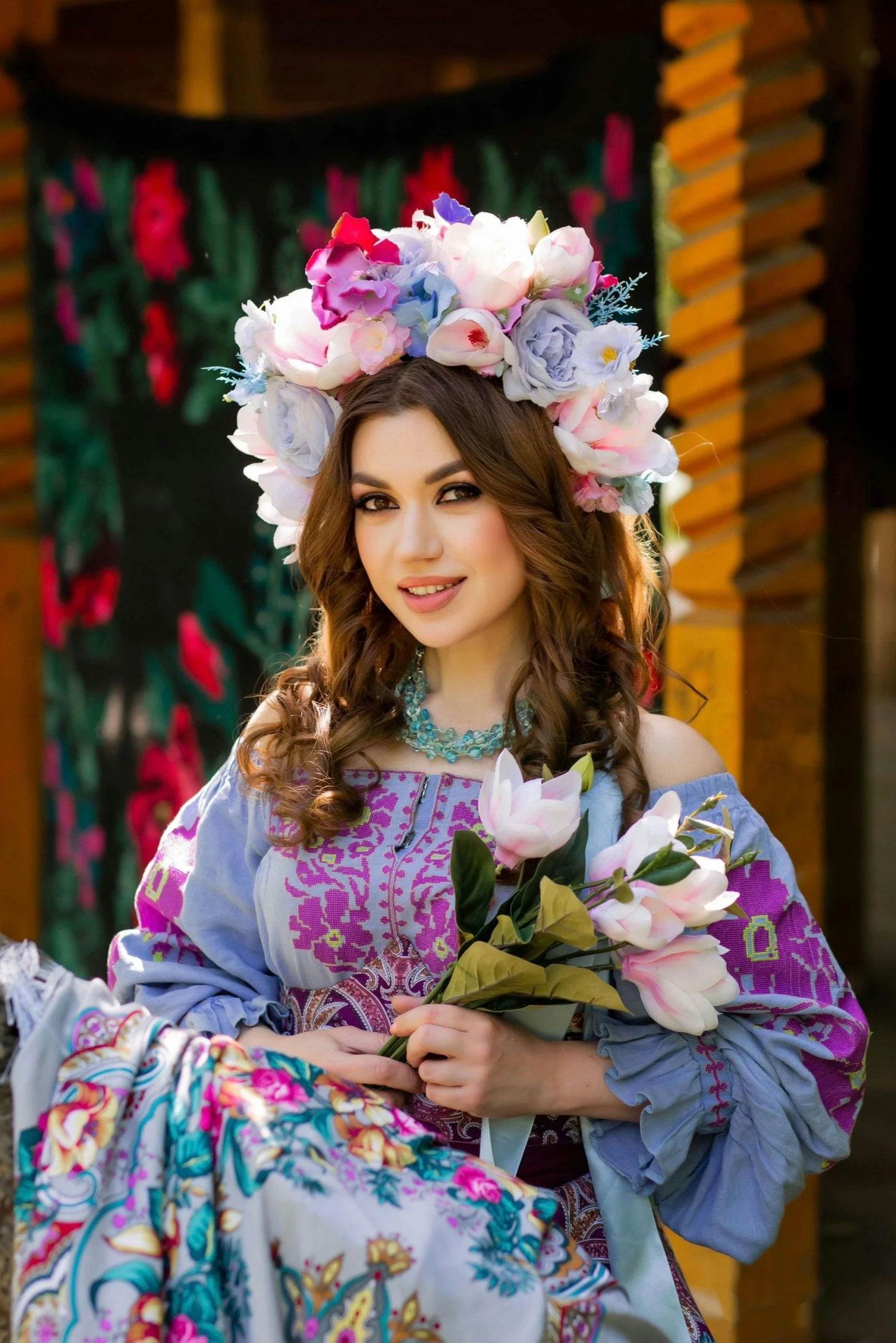 a young woman wearing flowers on her head and a floral crown