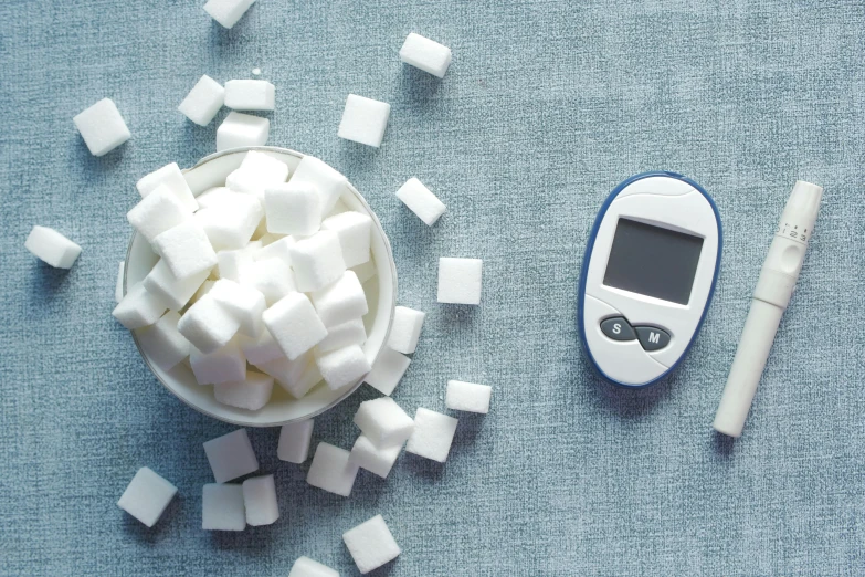 a pile of diced marshmallows in a bowl next to a digital camera