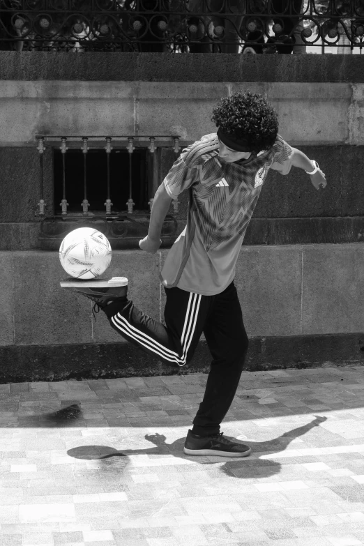 a skateboarder in the middle of performing tricks on the pavement