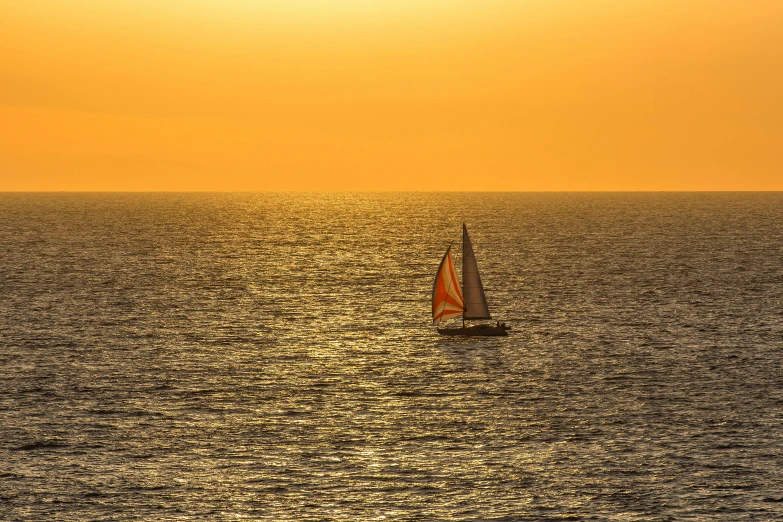 the sailboat is out on the open ocean