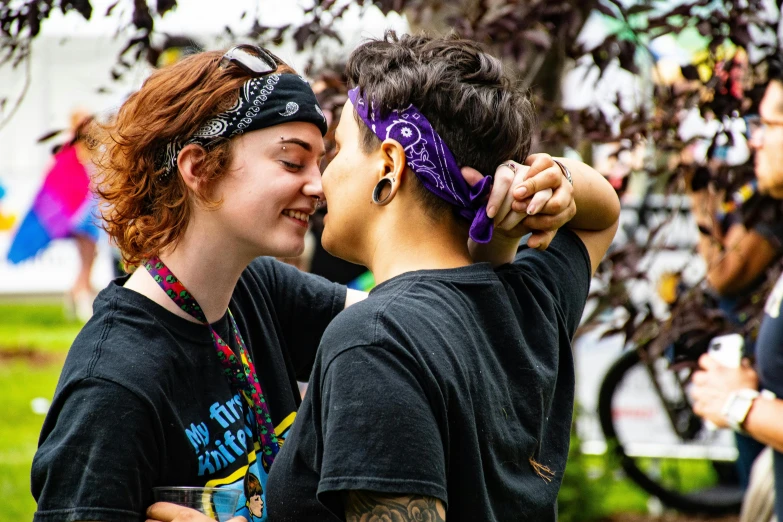 two young people with a mask on are posing for a picture