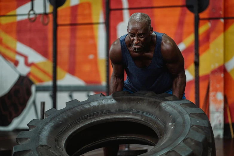 a man doing a h on a tire