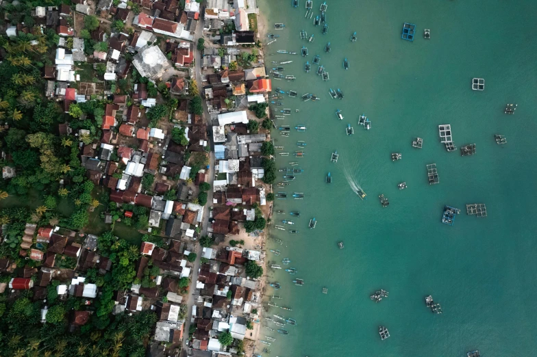 an aerial view of several houses near the ocean