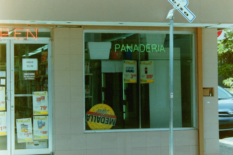 a store front with a sign advertising pancakes