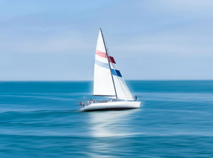 a sailboat sailing across the open ocean