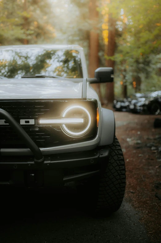 the light is on in front of a white truck