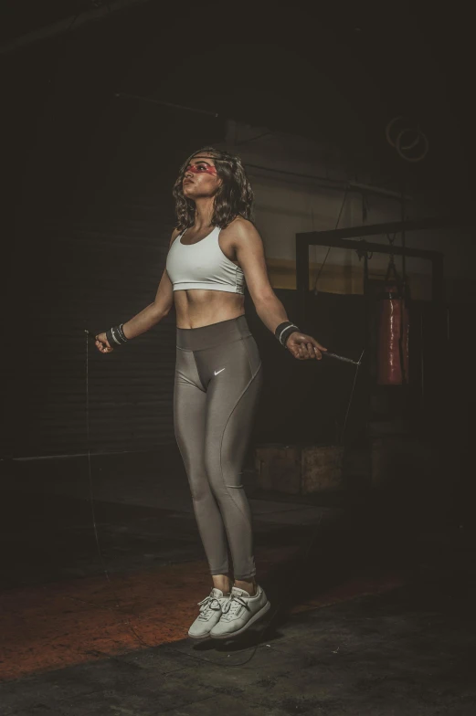 a woman standing on top of a wooden floor