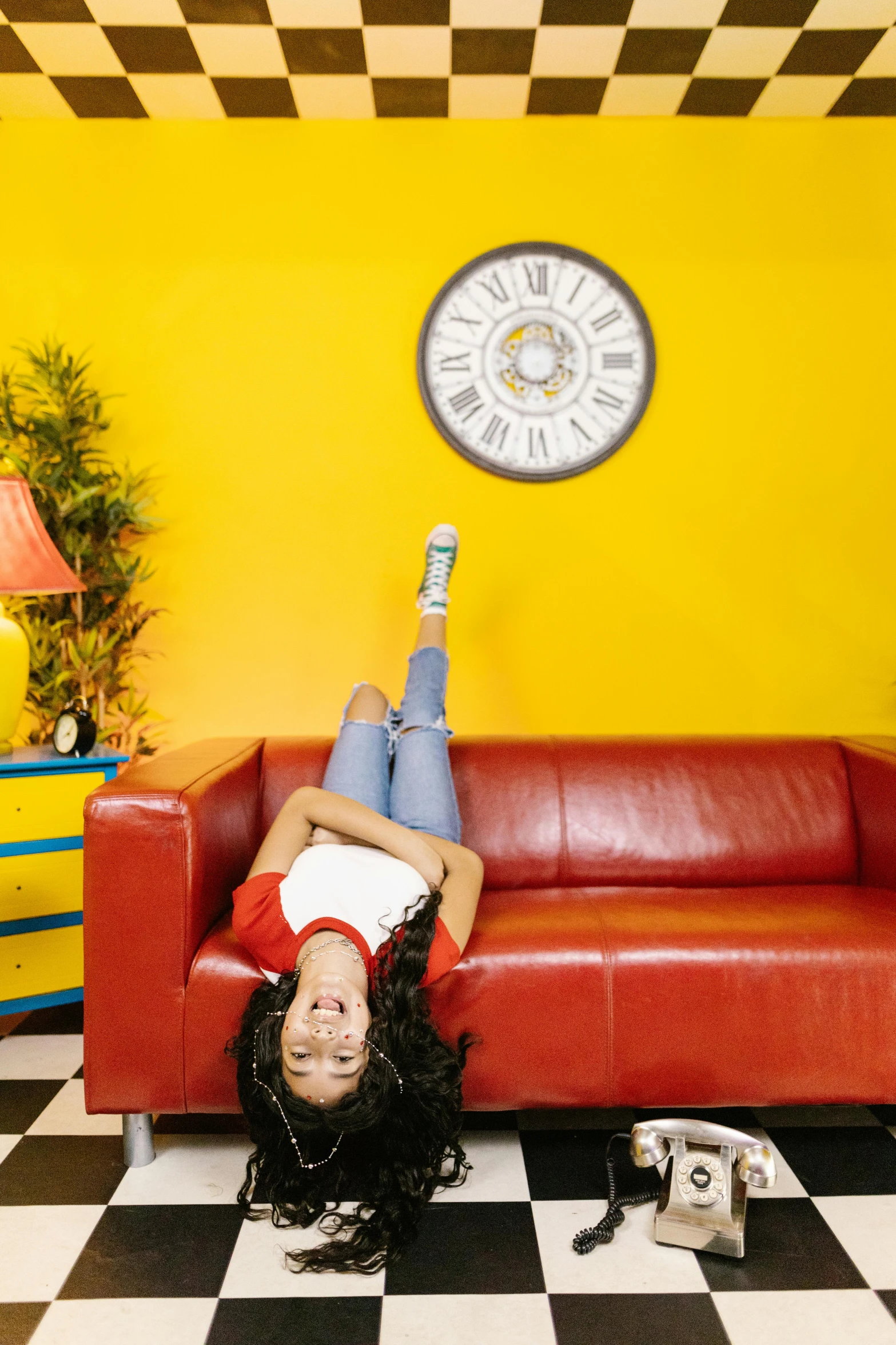 a person laying on the floor with their foot on the couch