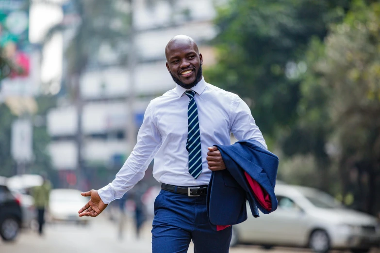 man in business suit running across the street