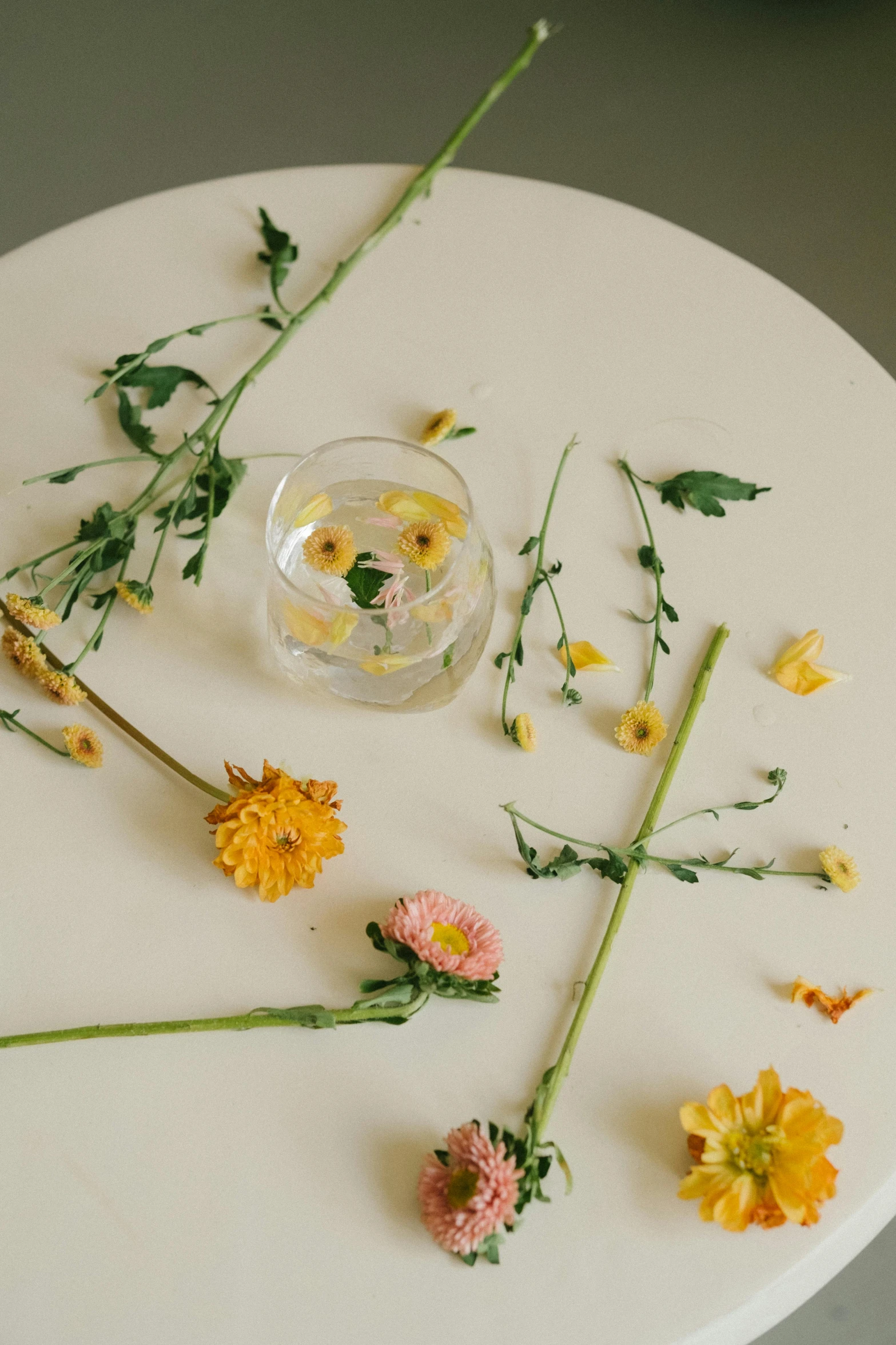 flowers that are laying on the table with water