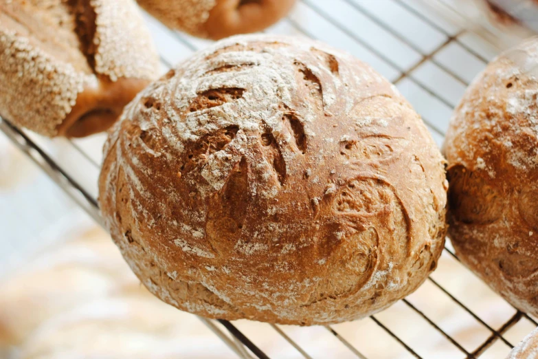 freshly baked bread sitting on a wire rack