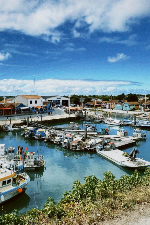 a group of boats that are docked in a harbor