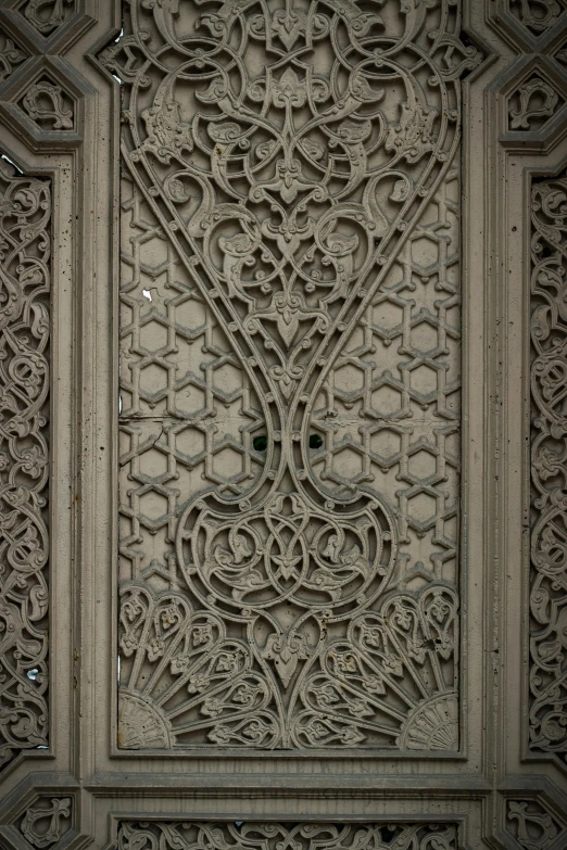 an intricate carved wall panel is featured in this image