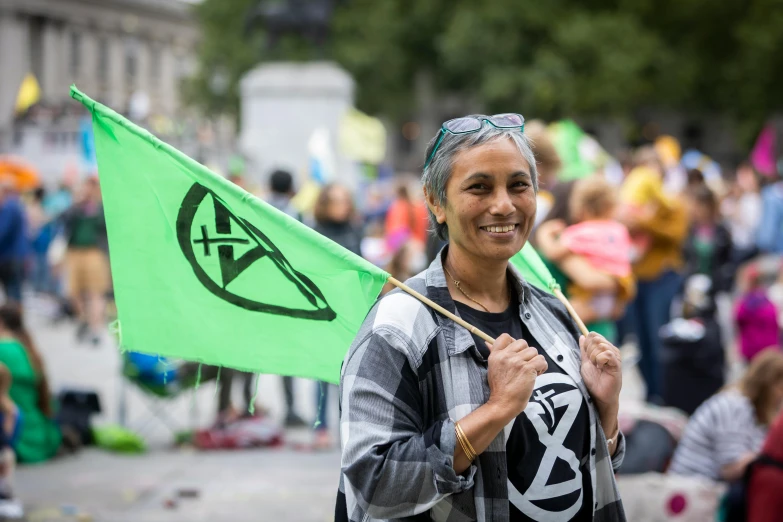 a woman holding a flag at an event