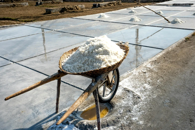 a wheelbarrow is loaded with cement ready for transportation