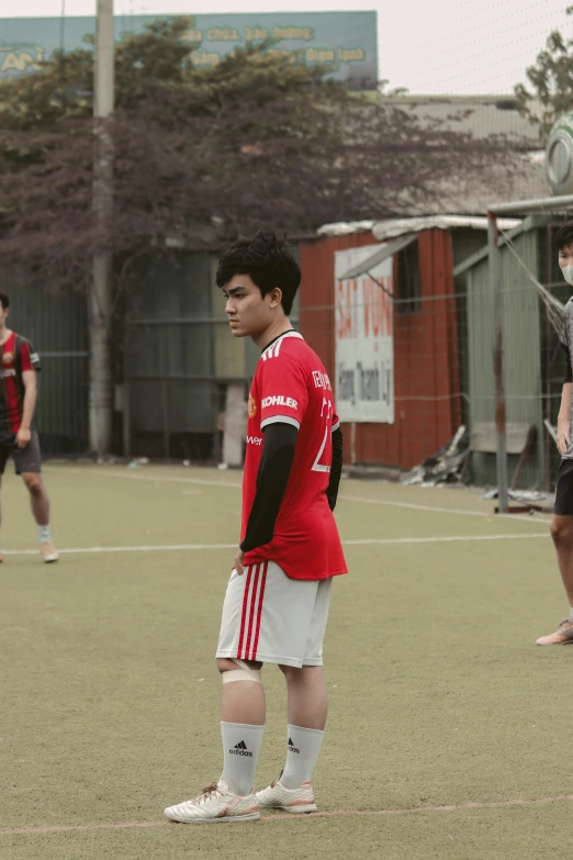 a man standing on top of a soccer field