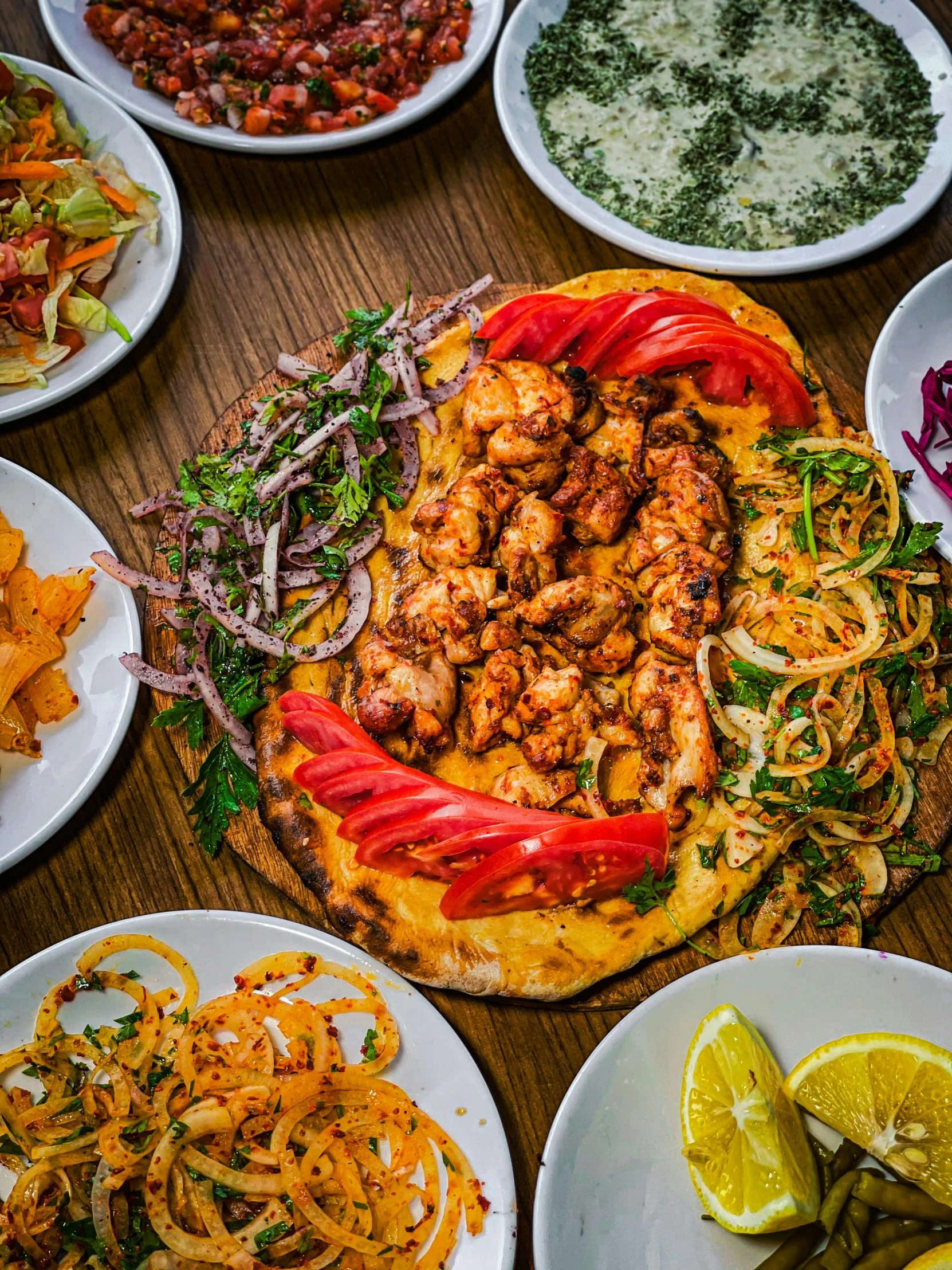 a bunch of plates and food layed out on a table