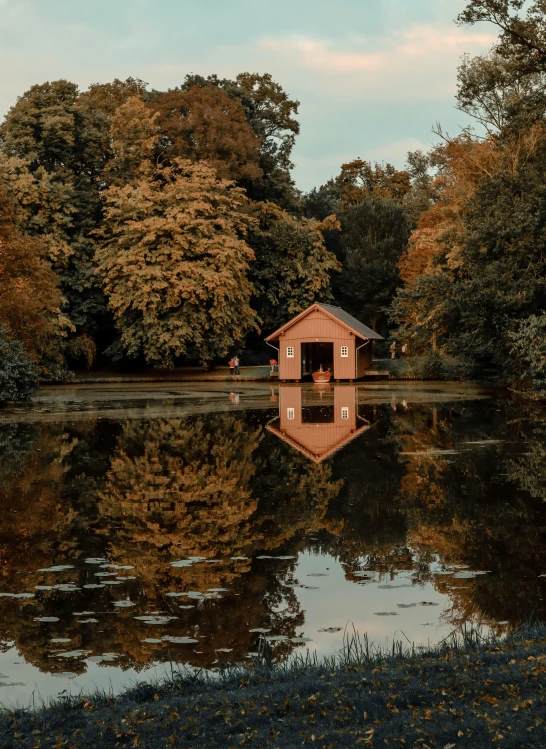 the reflection of a house in the water is all that remains