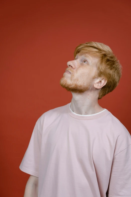 a young man with an eye patch and a red beard