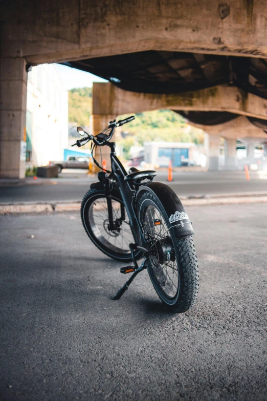 a bike is propped against the side of a bridge