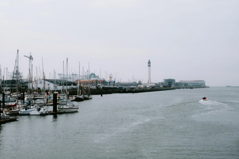 the water in a harbor that is filled with docked boats