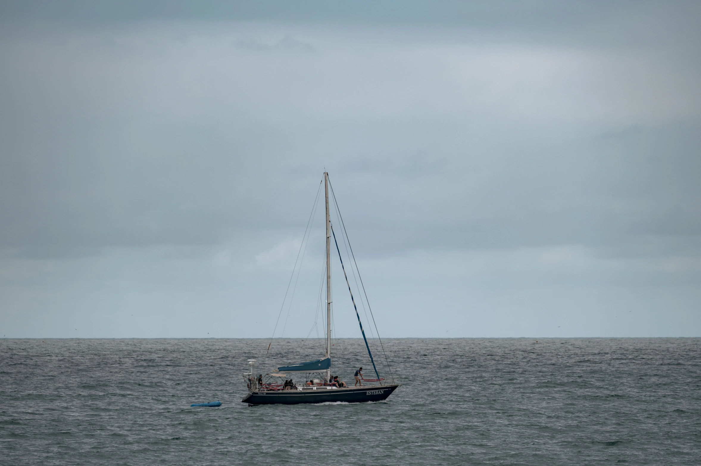 a sailboat sailing in the ocean in the daytime