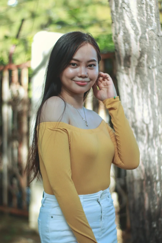 a young woman is posing for a po