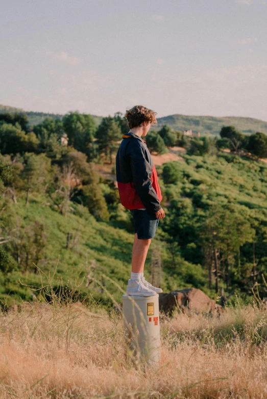 a person that is standing on a post