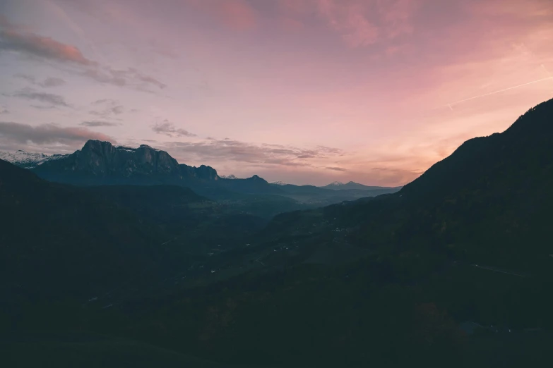 a hill side with some hills and mountains