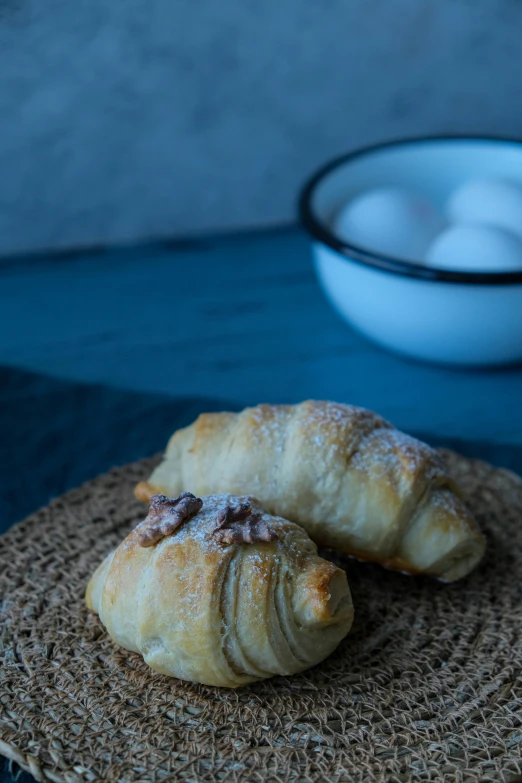 two pastry pieces are displayed on a plate