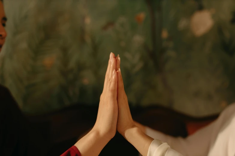 someone doing yoga in a room with a green wall