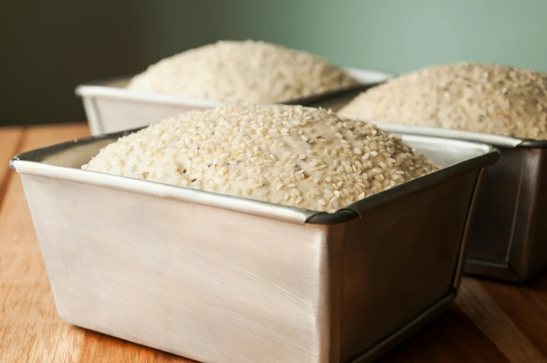 a tin full of white rice sits on a table