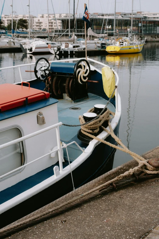 a boat tied to the dock in the harbor