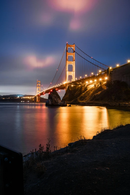 the bright lights of lights strung from a bridge