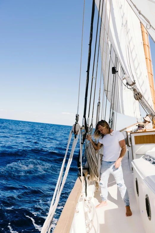 a couple on the front deck of a boat