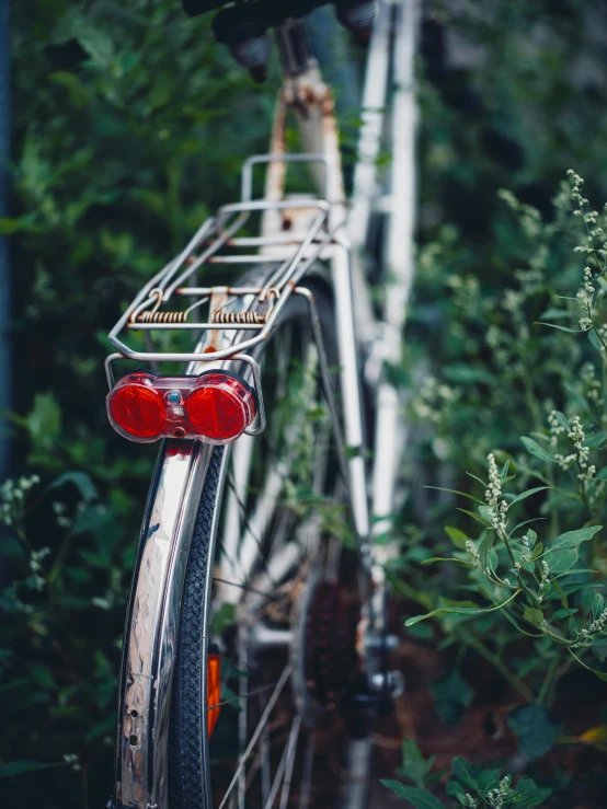 a bicycle rack is attached to the front wheel of it