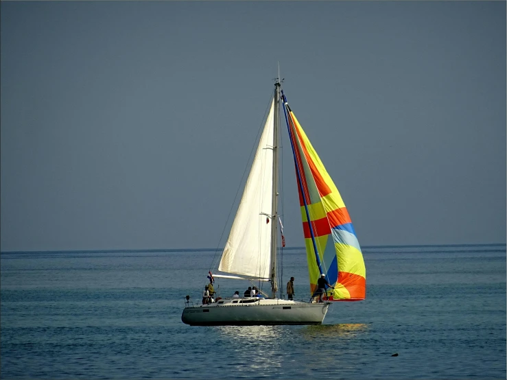 a sailboat sailing across an open body of water