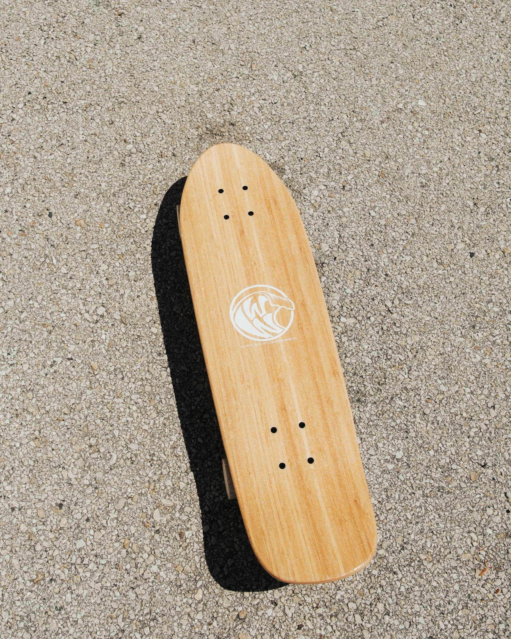 a skate board lays on top of the pavement