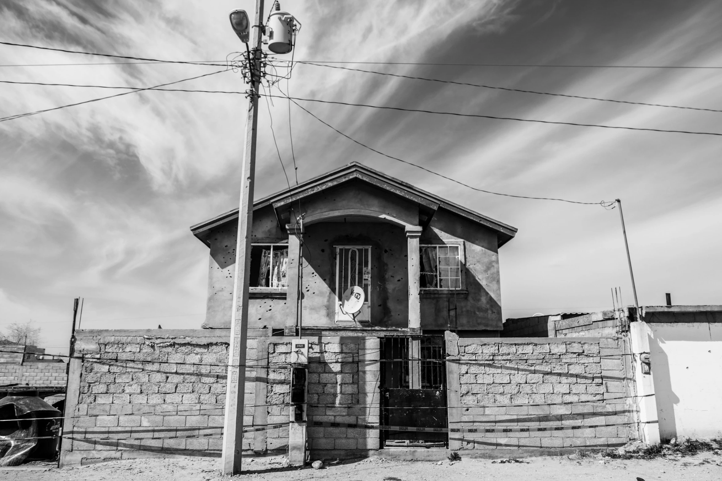 a small building that has been built with a gate