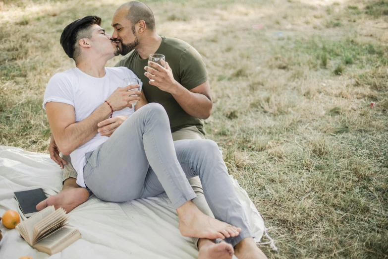 man giving a kiss to his companion in the park