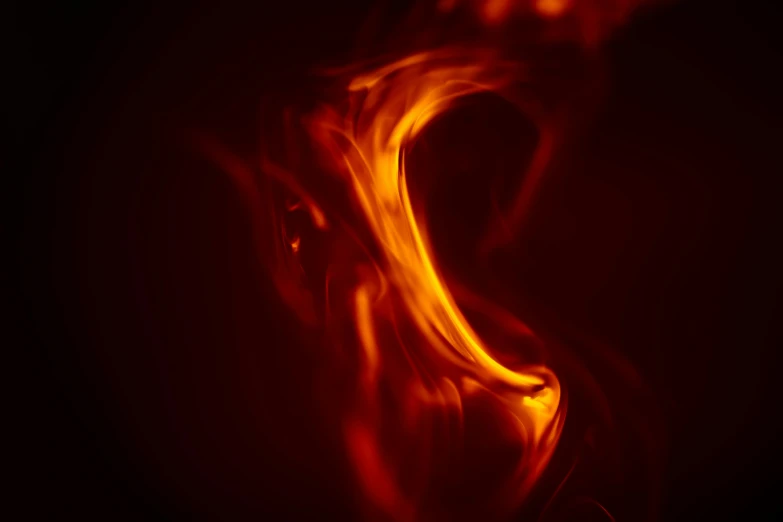 a red flame with black background and only one light