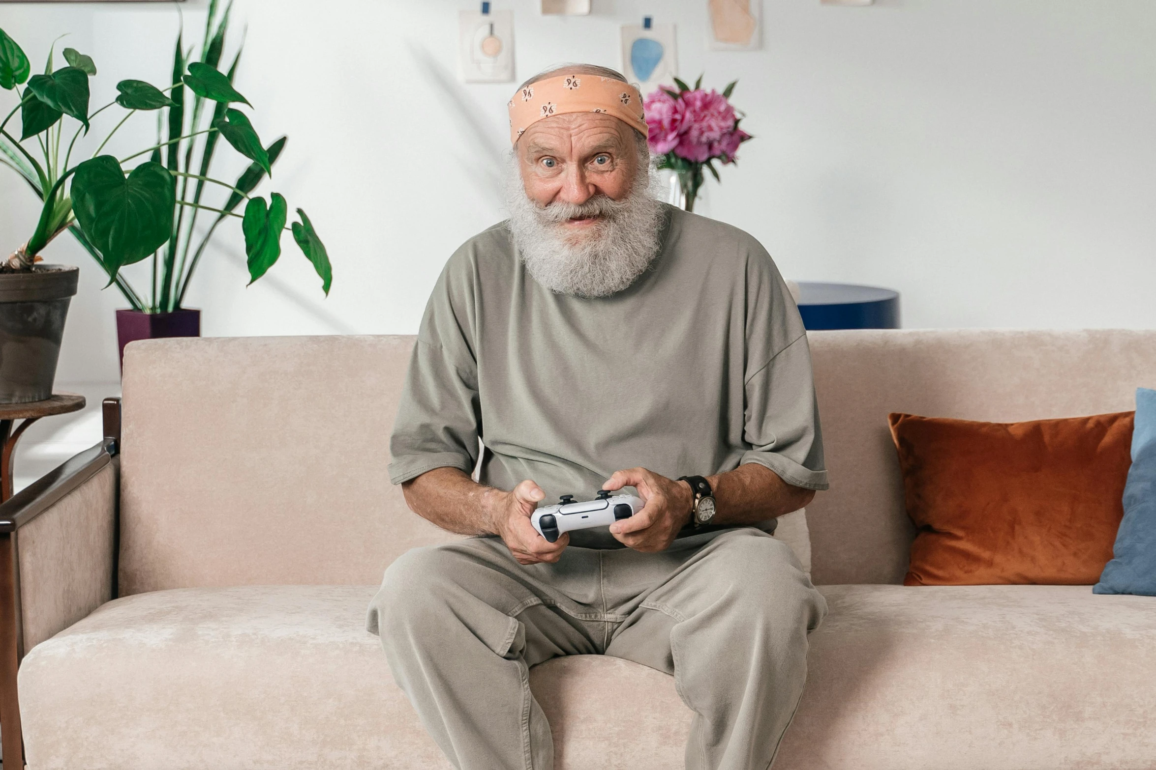 a bearded man holding his nintendo wii controller